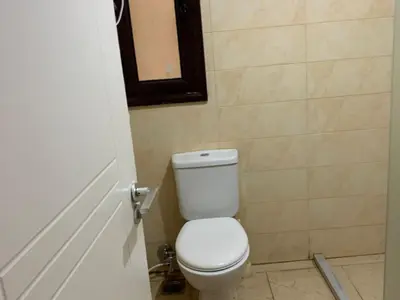 a bathroom with a white toilet in a room at One Bedroom Chalet with Side Sea View ,Turtles, Hurghada Concierge D 14 6 in Hurghada
