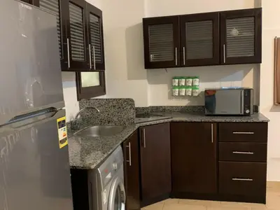 a kitchen with a sink and a dishwasher at One Bedroom Chalet with Side Sea View ,Turtles, Hurghada Concierge D 14 6 in Hurghada