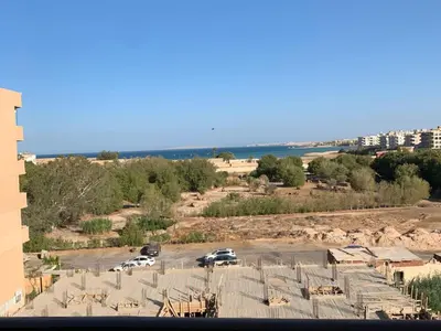 a view of a parking lot with cars parked at One Bedroom Chalet with Side Sea View ,Turtles, Hurghada Concierge D 14 6 in Hurghada
