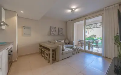 a living room with a couch and a table at New 1BR Apartment in Mangroovy El Gouna Pool, Beach, The Red Sea in Hurghada