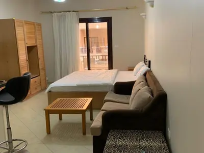 a living room with a bed and a couch at One-Bedroom Chalet at Turtles Beach Resort , Pool & Side Sea View C22 in Hurghada