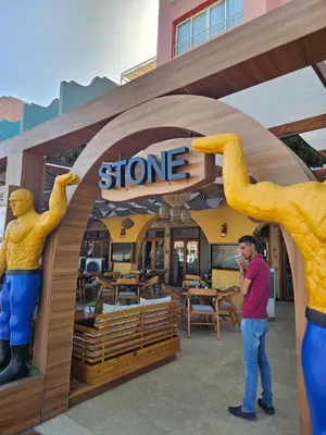 a man is standing in front of a store at Simplestays Hurghada in Hurghada