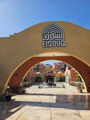 a building with an archway with a sign on it at Simplestays Hurghada in Hurghada