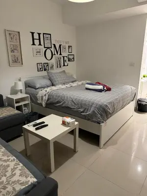a bedroom with a bed and a coffee table at Chic G Cribs Studio in El Gouna