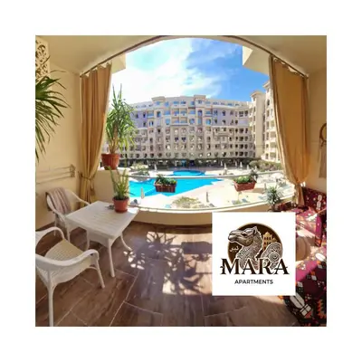 a hotel room with a view of a building at MARA Apartments Florenza Khamsin in Hurghada