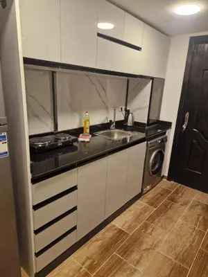 a kitchen with a sink and a dishwasher at MARA Apartments Florenza Khamsin in Hurghada