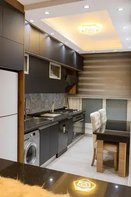 a kitchen with a washer and dryer and a table at Hurghada Sky Villa in Hurghada