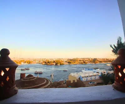 a view of a river from a window at Casa Nile View rooms - Nubian House -by kerma hospitality in Aswan