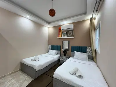 a room with two beds in a room at 2bedroom in selena bay resort in Hurghada