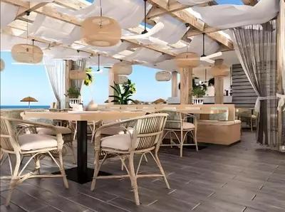 a dining room with a table and chairs at Fanadir Luxury Resort all inclusive in Hurghada