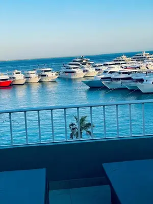 a group of boats are parked in the water at New Marina Luxury Suite in Hurghada
