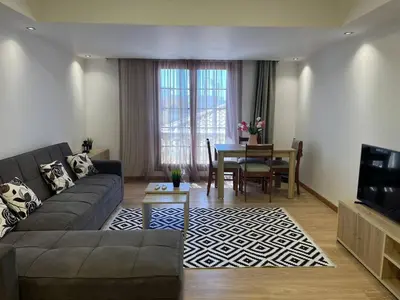 a living room with a couch and a table at Cozy One bedroom old town tawaya Sahel hashish in Hurghada