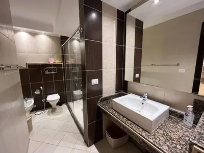 a bathroom with a sink and a toilet at Cozy One bedroom old town tawaya Sahel hashish in Hurghada