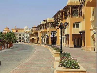 an empty street in a city with buildings at Cozy One bedroom old town tawaya Sahel hashish in Hurghada