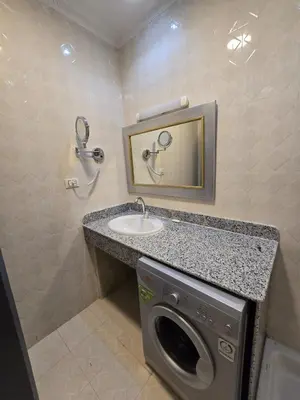 a bathroom with a washing machine and a sink at مصر in Hurghada