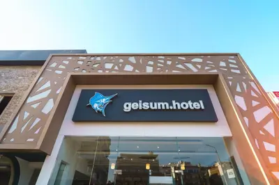 a sign for a gellum hotel on top of a building at Geisum beach hotel in Hurghada