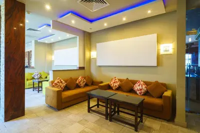 a waiting room with a couch and a screen at Geisum beach hotel in Hurghada