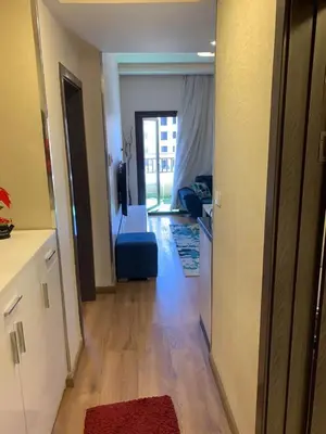 a room with a hallway with a living room with a couch at for the best all-rounder sea view Hurghada Apartment&DownTown AlDau in Banī Ghālib