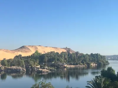 an island in the middle of a body of water at Aswan Holistic Hotel in Aswan