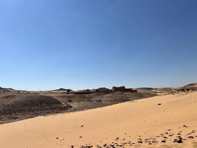 a sand dune in the middle of the desert at Aswan Holistic Hotel in Aswan