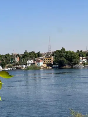 a view of a river with houses and trees at Aswan Holistic Hotel in Aswan