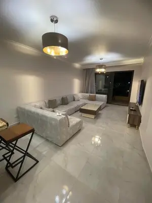 a living room with a couch and a table at Special Apartment For Rent 103 in Hurghada