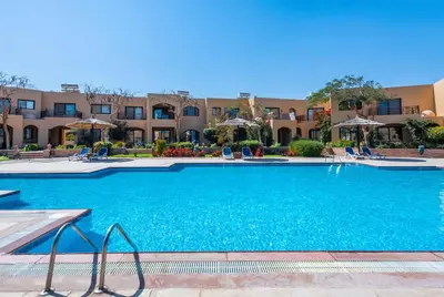 a large swimming pool in front of a building at Special Apartment For Rent 103 in Hurghada