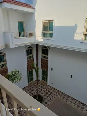 a view of the outside of a white building at Suncare America Resort - luxury rooms in Hurghada