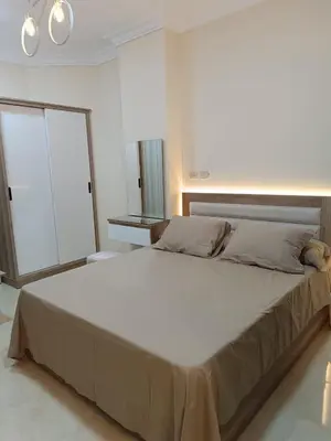 a large bed in a white room with a large bed sidx sidx sidx at Hurghada Sea view with pool in Hurghada