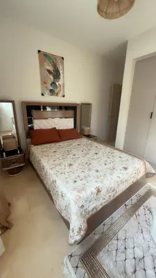 a bedroom with a large bed in a room at Azzurra villa in Hurghada