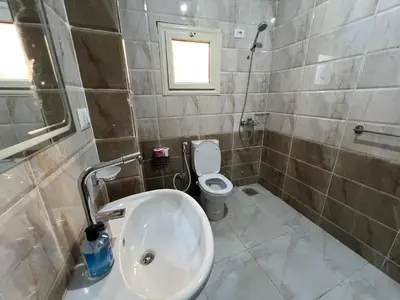 a bathroom with a sink and a toilet at Aswan City Star in Aswan