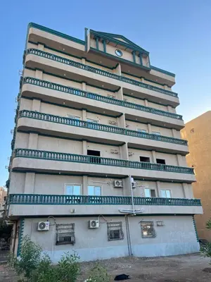 a tall building with balconies on the side of it at Aswan City Star in Aswan