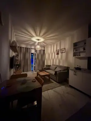 a living room with a couch and a table at Magawish resort in Hurghada