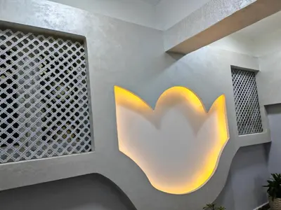 a lobby with a logo on the wall at THE BESt in Hurghada