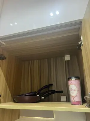 a can sitting on a shelf next to a bowl at La Bela Resort in Hurghada