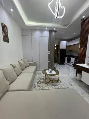 a living room with a couch and a table at La Bela Resort in Hurghada