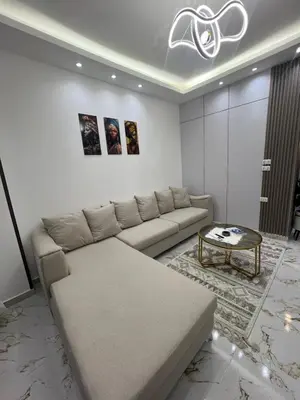 a living room with a couch and a coffee table at La Bela Resort in Hurghada