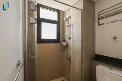 a bathroom with a shower and a window at The 2BDR Blue Horizon Kamaran El Gouna in Hurghada