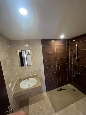 a bathroom with a sink and a shower at شاليه بمنتجع ميراج Mirage apartments in Hurghada