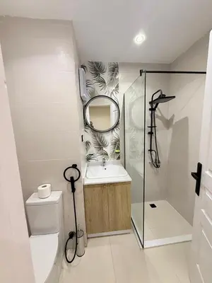 a bathroom with a sink and a mirror and a toilet at Nubia Beach Resort in Hurghada
