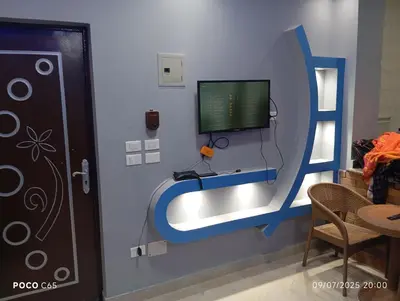 a room with a computer monitor on a wall at Red Ruby chalets & flats HRG Elgouna in Hurghada