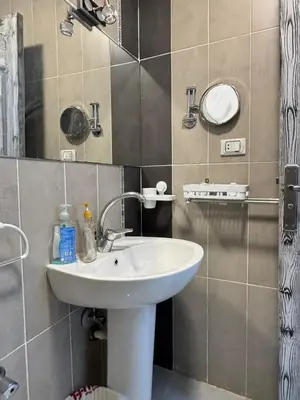 a bathroom with a sink and a mirror at Inter Prime apartment 4 in Hurghada