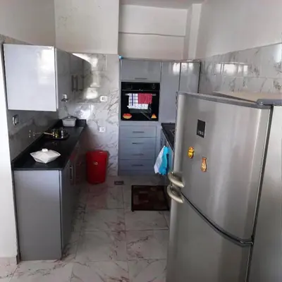 a kitchen with a stainless steel refrigerator in it at family villa private pool in Luxor