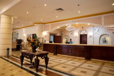 a lobby with a reception desk in a building at Dexon Roma All Inclusive Hotel in Hurghada