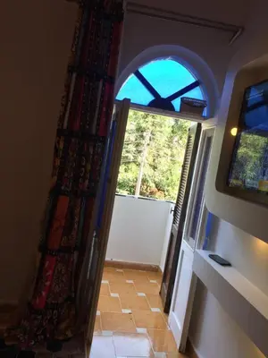 a room with an open door with a window at Gana kato in Aswan
