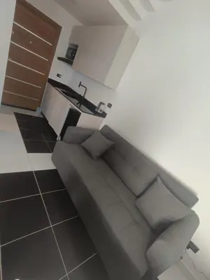 a living room with a couch and a sink at Royal Beach Resort in Hurghada