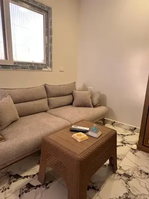 a living room with a couch and a coffee table at Morsy Palace in Luxor