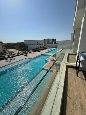 a swimming pool on the side of a building at ELGOUNA Maraya duplex pool view in Hurghada