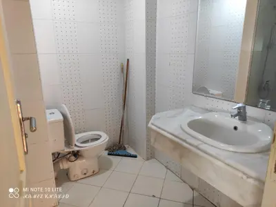 a bathroom with a sink and a toilet at Relaxing Apartment in Hurghada