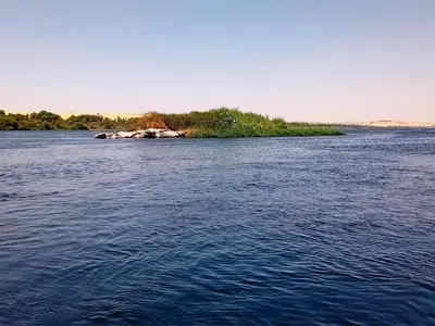an island in the middle of a large body of water at Katadool Boat in Aswan